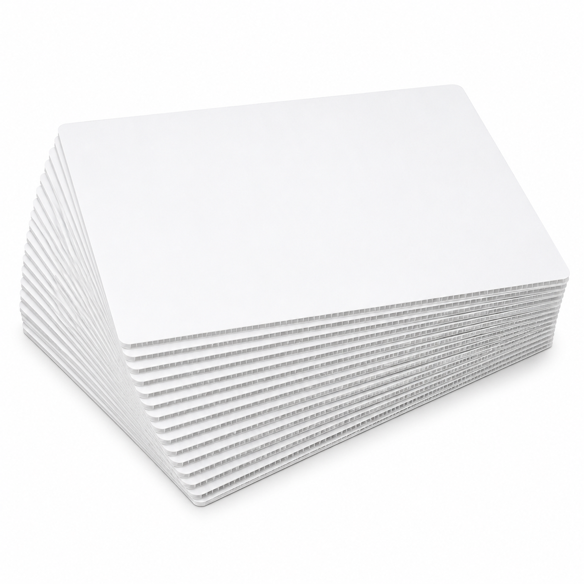 Pack of 25 white rectangle coroplast sheet cake boards fanned out, showing the 4mm corrugated plastic edge