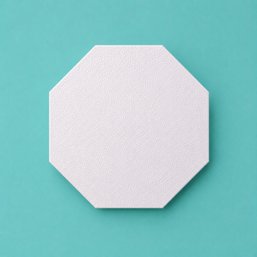 Octagon foam cake dummy 4 inch point to point, seen from above showing eight equal faces, smooth white finish