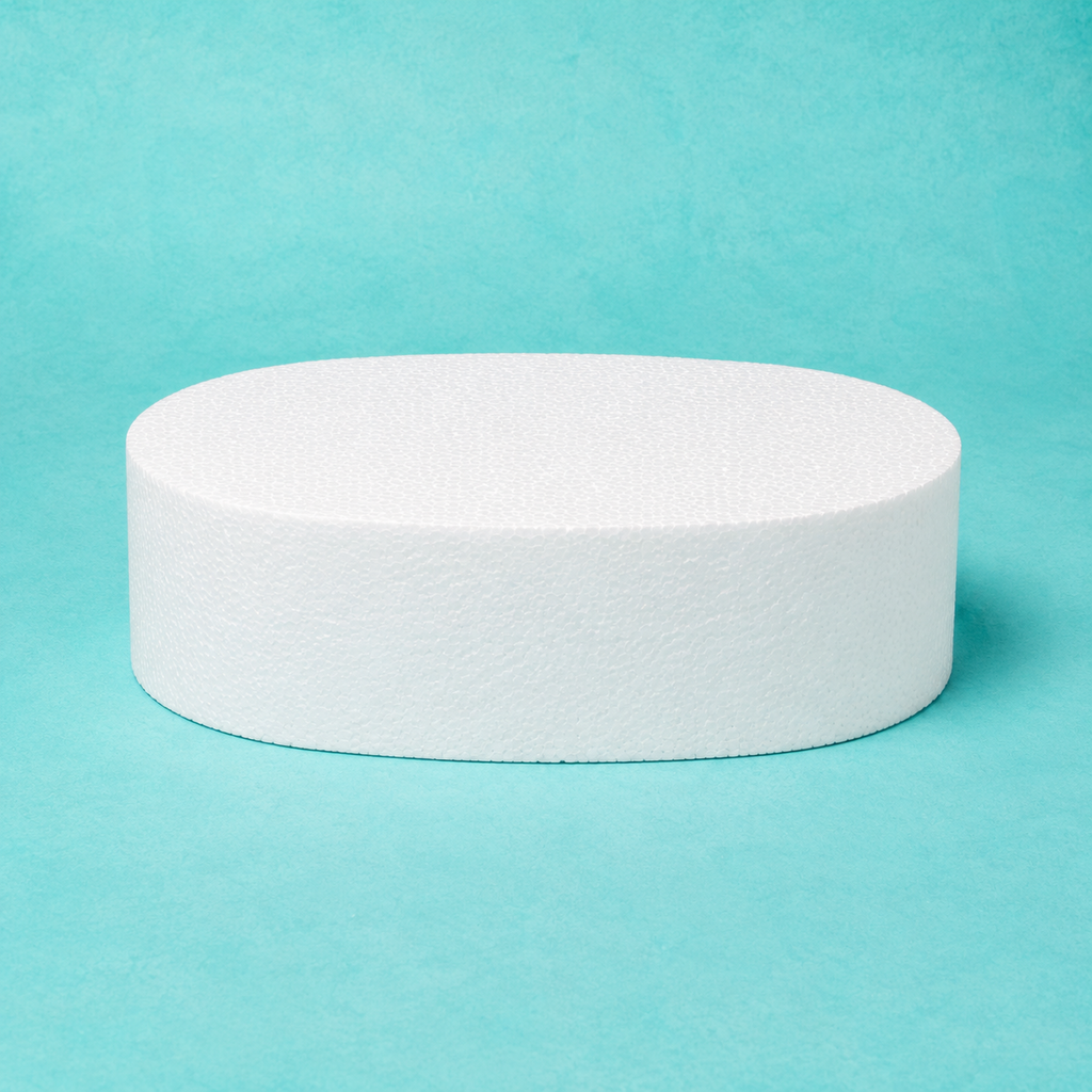 Oval foam cake dummy 10 by 7 inch, 4 inches tall, seen from the front showing the perpendicular side and crisp top rim