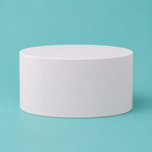 Oval foam cake dummy 10 by 7 inch seen from the front, showing the perpendicular side and crisp top rim
