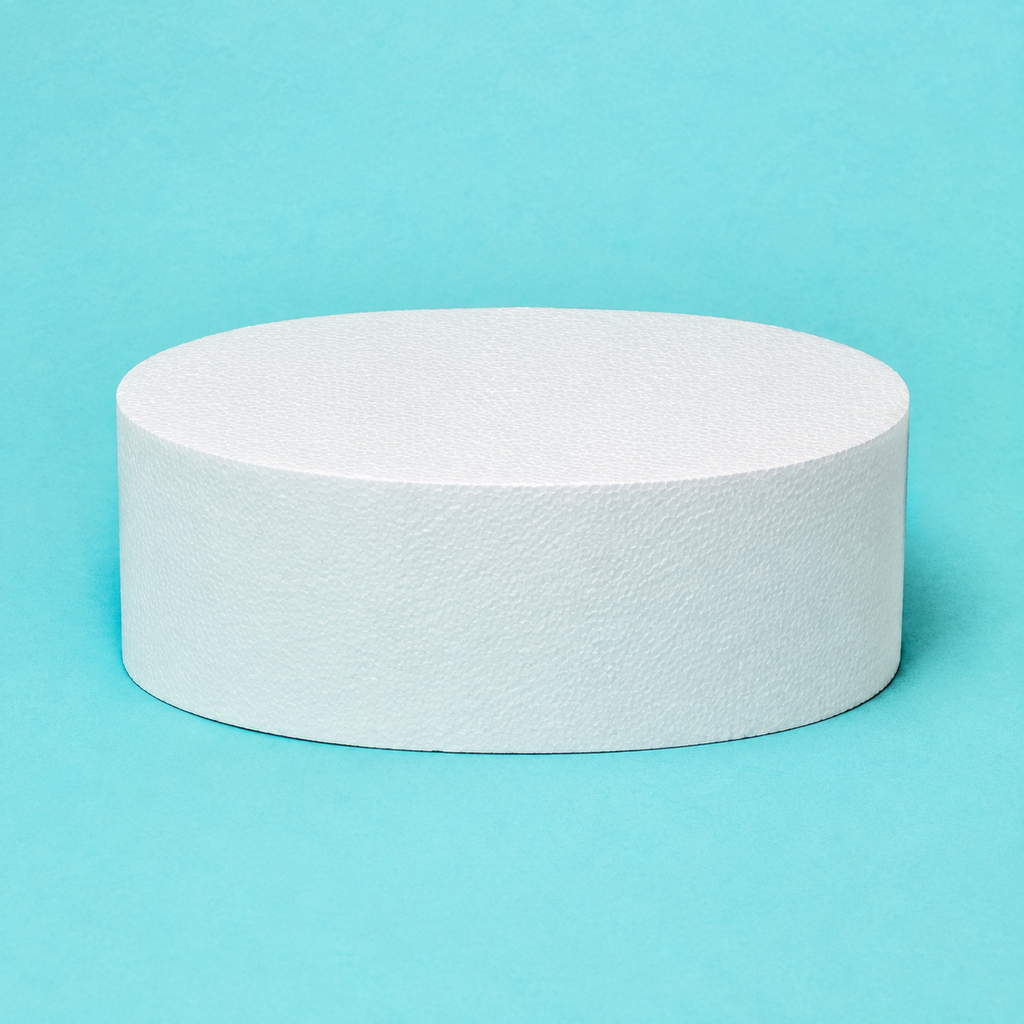 Oval foam cake dummy 12 by 9 inch, 5 inches tall, seen from the front showing the perpendicular side and crisp top rim