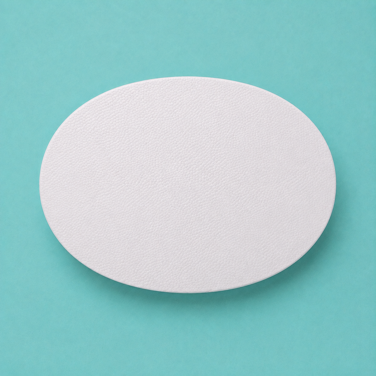 Oval foam cake dummy 14 by 10 inch base tier, seen from above showing the true elliptical profile, smooth white finish