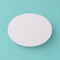 Oval foam cake dummy 8 by 6 inch, seen from above showing the true elliptical profile, smooth white finish