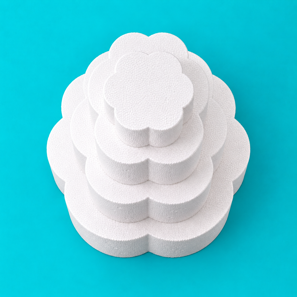 Top view of 4-tier petal-shaped foam cake dummy set, 14, 12, 10 and 8 inch tiers, showing scalloped petal edge, smooth white finish
