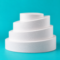 4-piece round foam cake dummy set, angled hollow-cut design, 24, 22 and 20 inch tiers sloped 3 to 6 inches tall, plus a flat 12 inch top platform, smooth white finish