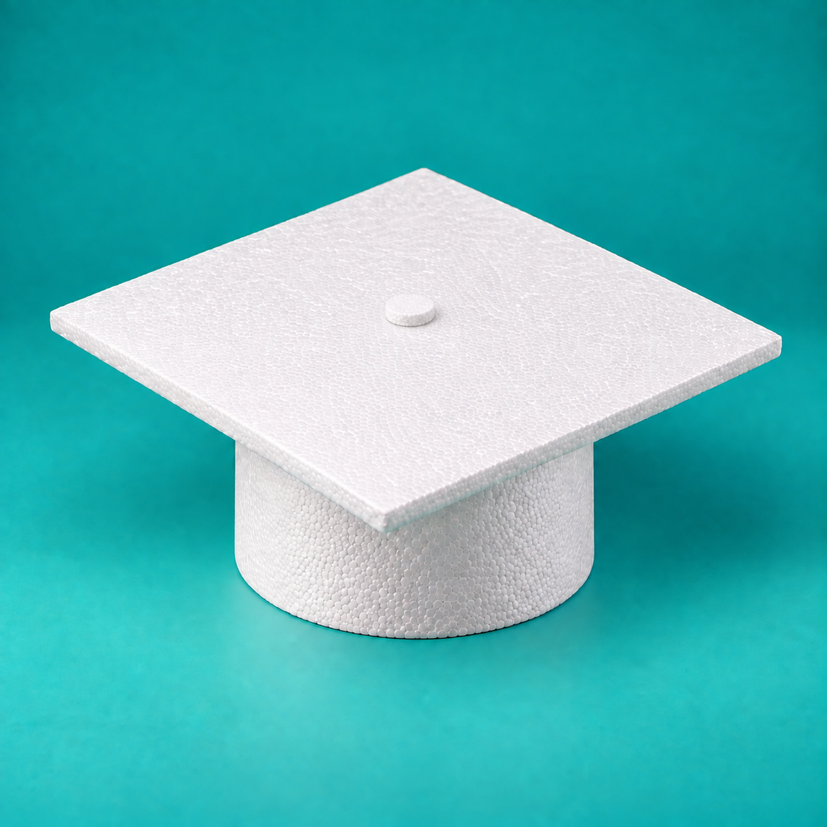 Graduation cap foam cake dummy front view showing square mortarboard top over round foam base
