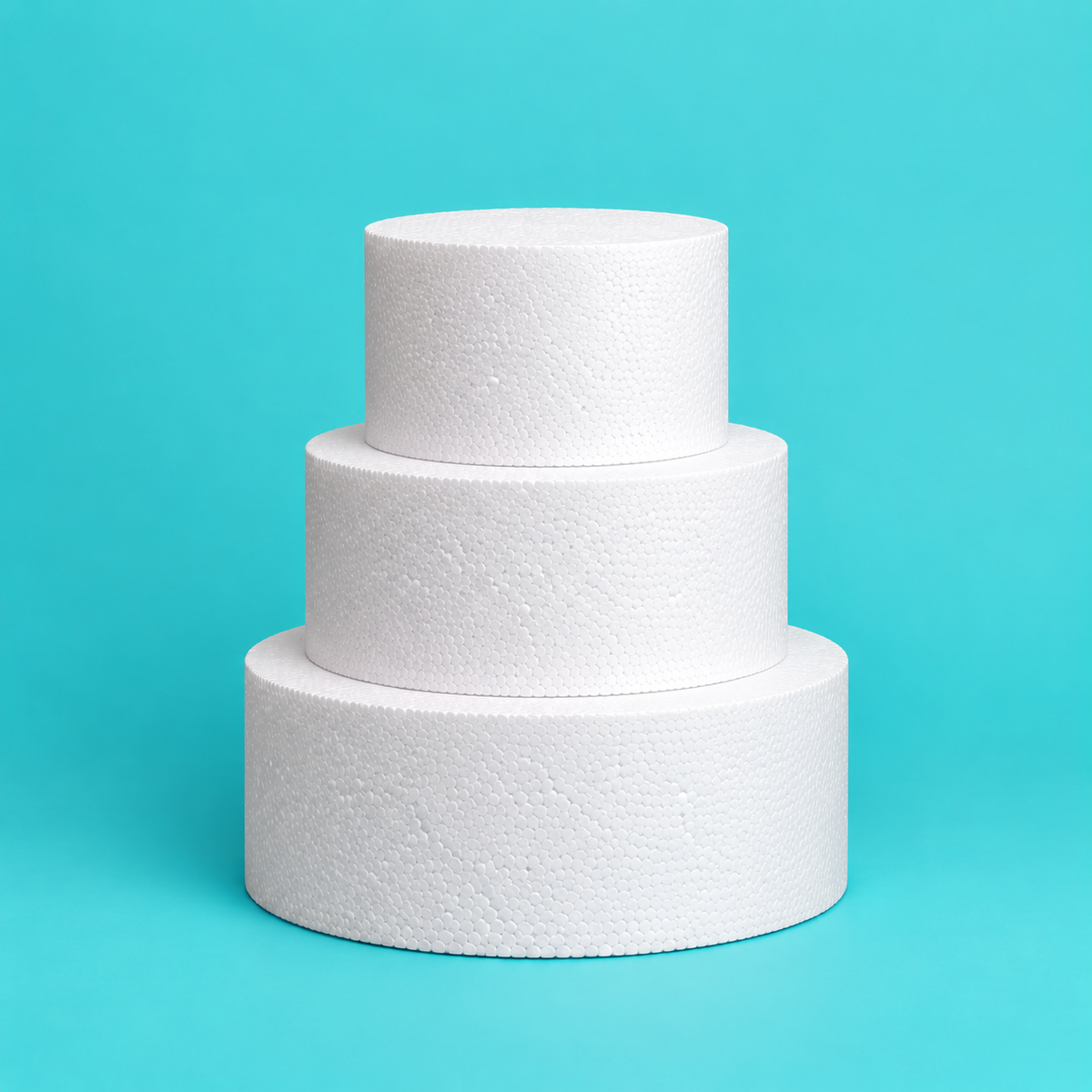 Round foam cake dummy tower set, three stacked tiers 5, 7 and 9 inches in diameter, each 4 inches tall, smooth white finish