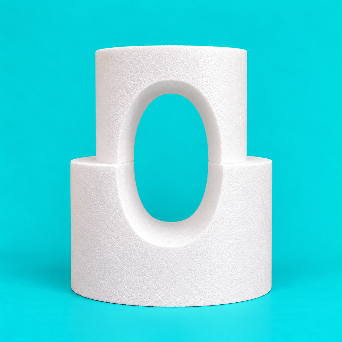 Two-tier round foam cake dummy tower with vertical oval cutout, diameters 8 and 10 inches, smooth white finish