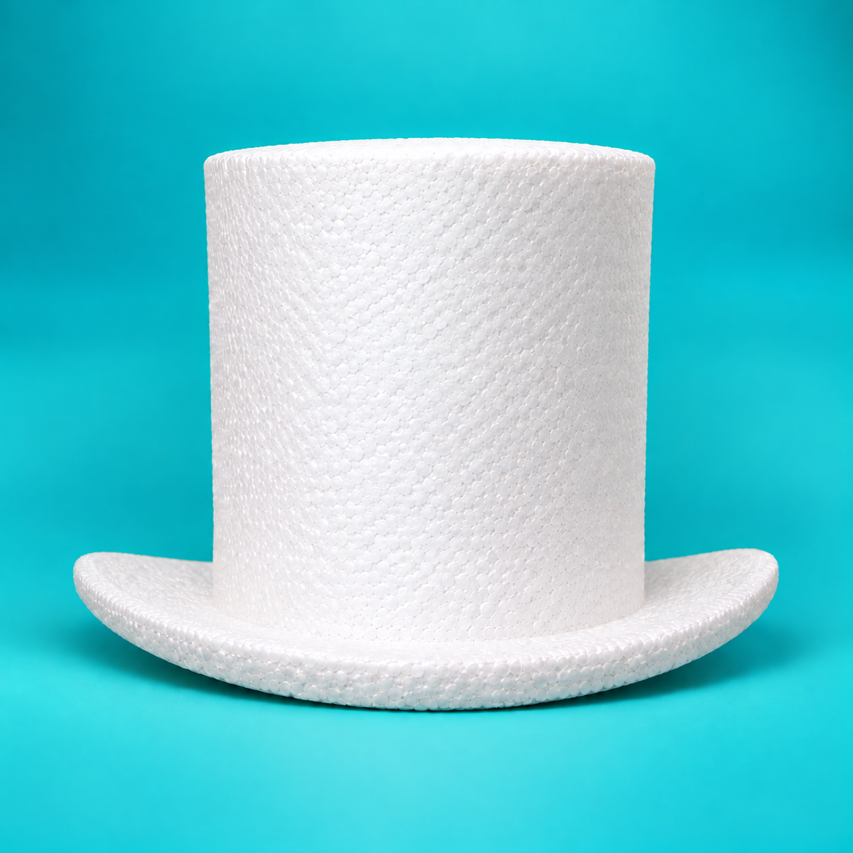 White top hat foam cake dummy with tall round crown and oval brim with curved upstand, front view